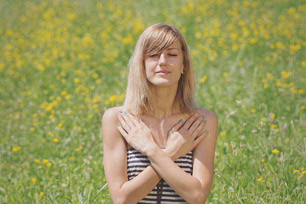 istock Girl relaxing in a field. 516714340