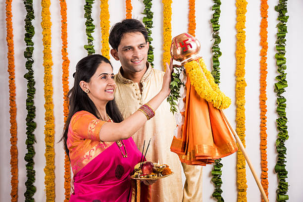 istock smart indian couple performing gudhi padwa puja 516714764