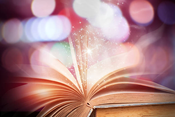 istock Abstract magic book on wooden background 516715462