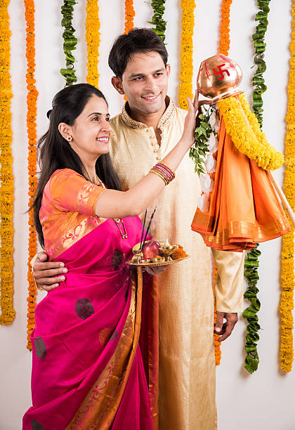 istock smart indian couple performing gudhi padwa puja 516715826