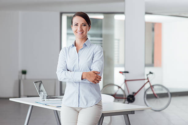 istock Beautiful woman in the office 516715952