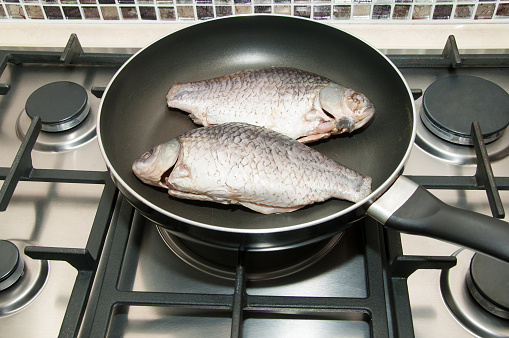Raw fish on the pan ready for cooking