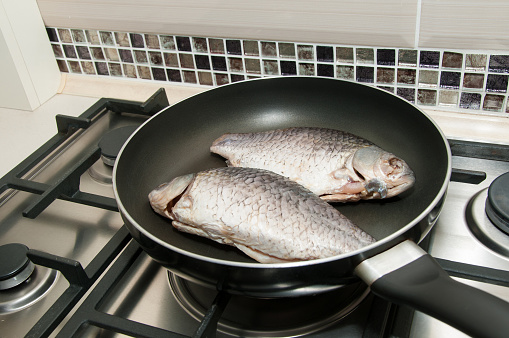 Raw fish on the pan ready for cooking