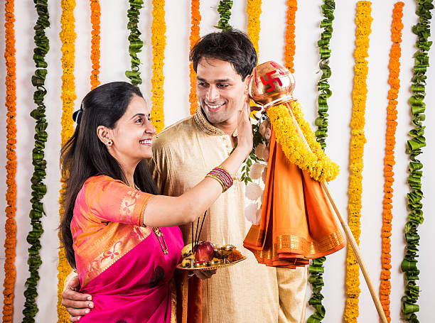 istock smart indian couple performing gudhi padwa puja 516716404
