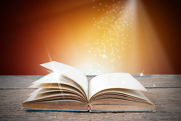 istock Abstract magic book on wooden background 516716864