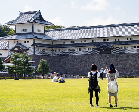 Kanazawa, Japan - September 28, 2015: Tourists taking pictures of historic Kanazawa castle