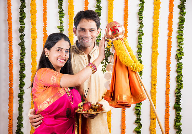 istock smart indian couple performing gudhi padwa puja 516717000