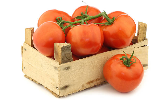 istock fresh tomatoes in a wooden crate 516717312