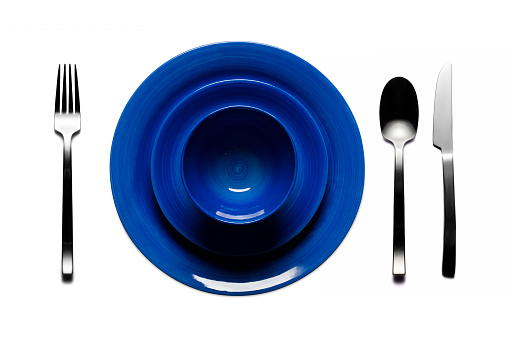 plates and cutlery on a white background