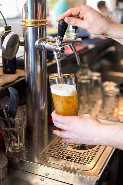 istock beer tap pouring a draught lager beer 516717922