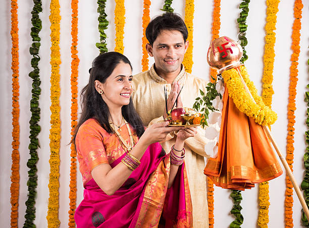 istock smart indian couple performing gudhi padwa puja 516717968