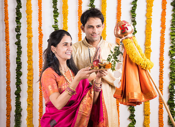 istock smart indian couple performing gudhi padwa puja 516718542