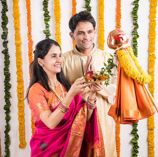 smart indian couple performing gudhi padwa puja