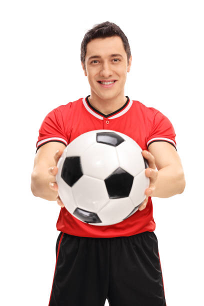istock Young football player holding a ball 516719094