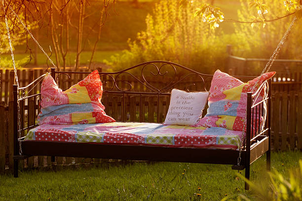 istock Bed in the garden at sunset / timeout 516719326