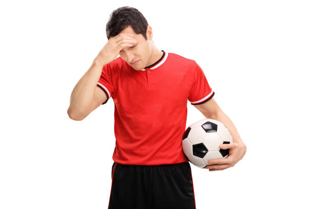 istock Sad football player looking down 516719430