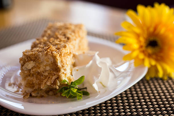 istock yellow flower on the table next to the cake 516719644