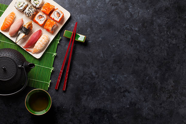 istock Set of sushi, maki and green tea 516720150
