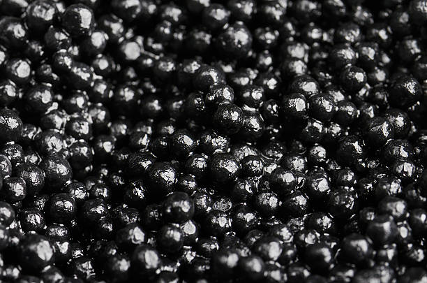 istock black caviar on a full background close-up. horizontal 516720178