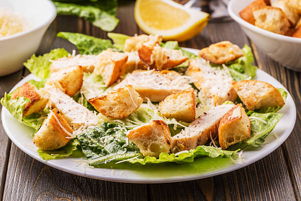 istock Homemade Chicken Caesar Salad with Cheese and Croutons. 516720548