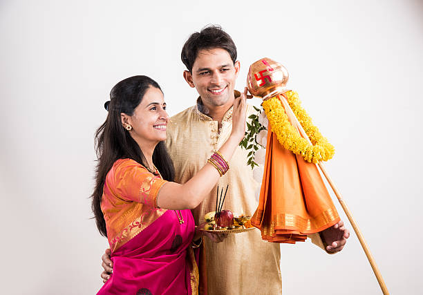 smart indian couple performing gudhi padwa puja