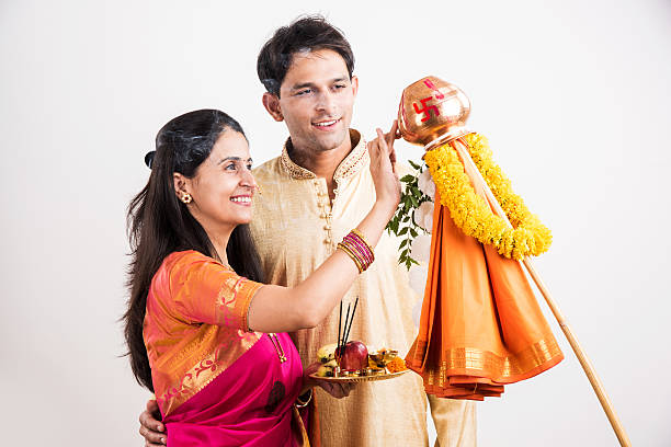 istock smart indian couple performing gudhi padwa puja 516721368