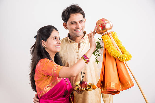 istock smart indian couple performing gudhi padwa puja 516721738