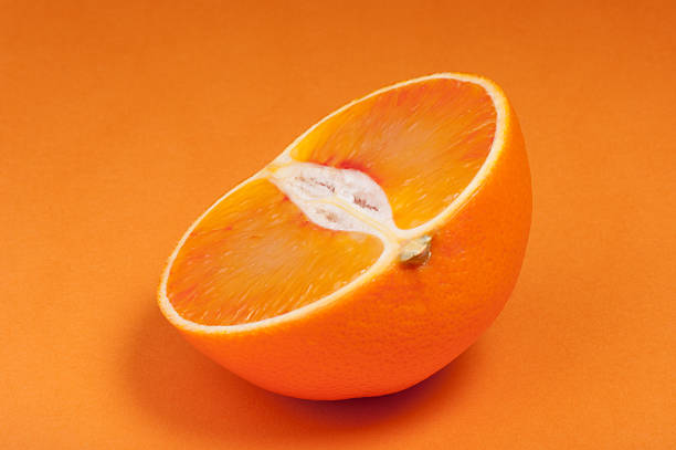 istock Half of blood red sicily orange. Studio shoot. 516722120