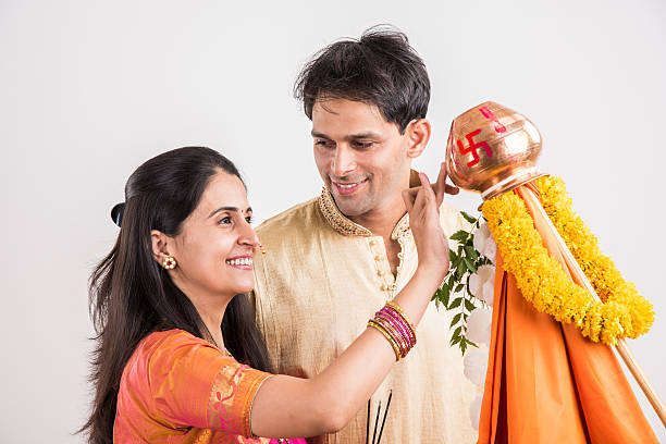 istock smart indian couple performing gudhi padwa puja 516722268