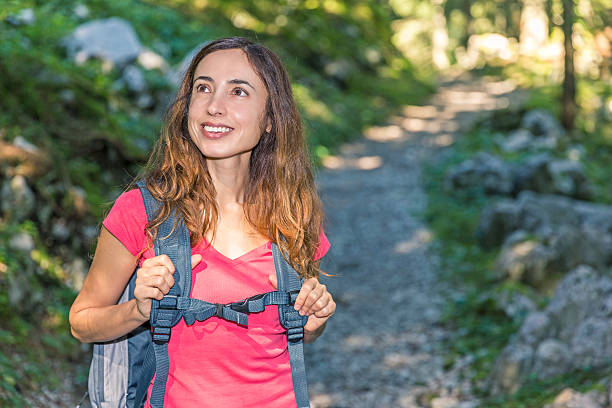 istock Woman hiking in the forest 516722434