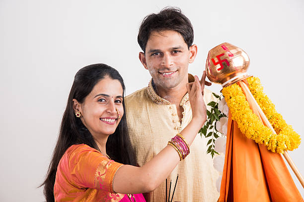 istock smart indian couple performing gudhi padwa puja 516722464
