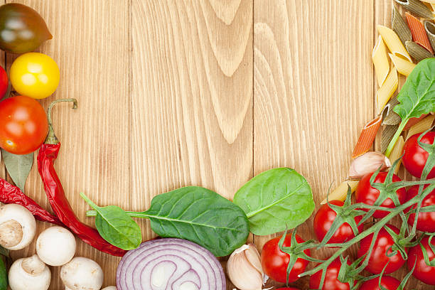 istock Fresh ingredients for cooking: pasta, tomato, cucumber, mushroom 516722578