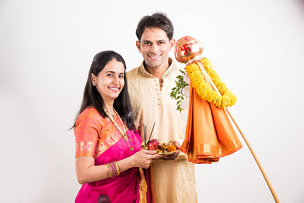 istock smart indian couple performing gudhi padwa puja 516722890