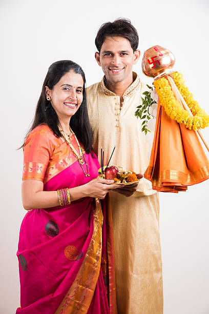 istock smart indian couple performing gudhi padwa puja 516723720