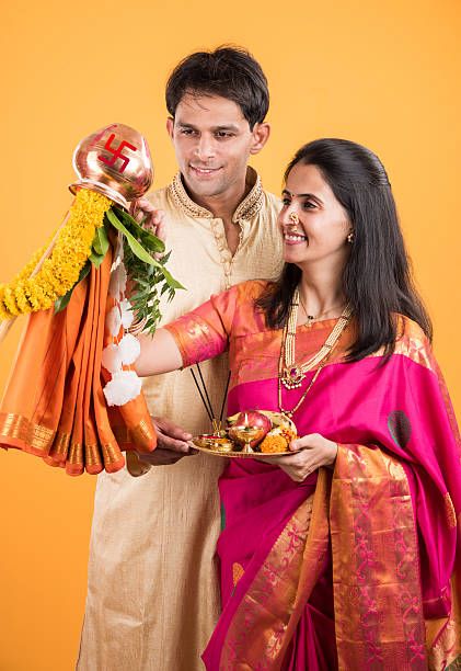 smart indian couple performing gudhi padwa puja