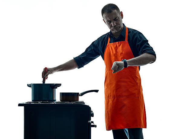 istock man cooking chef silhouette isolated 516724528