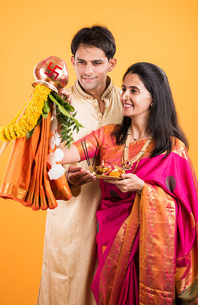 istock smart indian couple performing gudhi padwa puja 516724722
