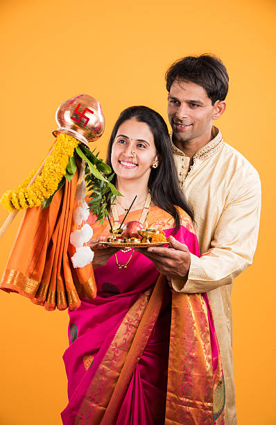 istock smart indian couple performing gudhi padwa puja 516725182