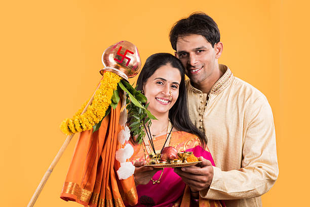 istock smart indian couple performing gudhi padwa puja 516726348