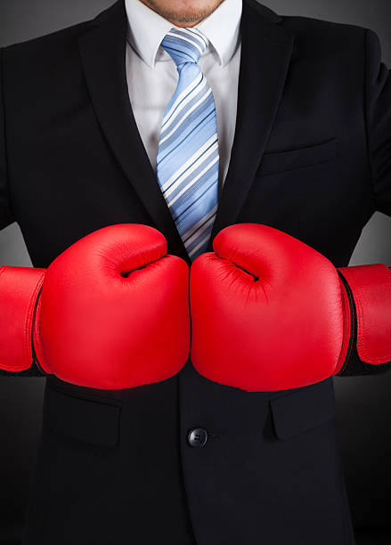istock Businessman Wearing Boxing Gloves 516727555