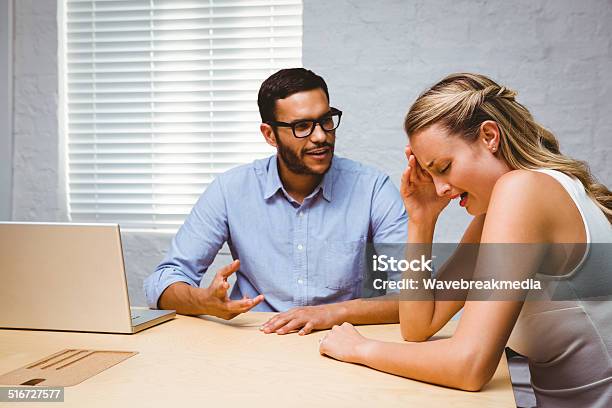 Casual Colleagues In An Argument At Desk Stock Photo - Download Image Now - 30-34 Years, 30-39 Years, Adult