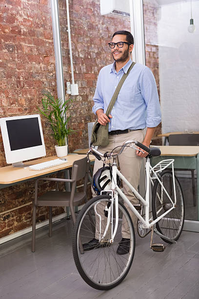 istock Casual businessman with his bicycle 516727679