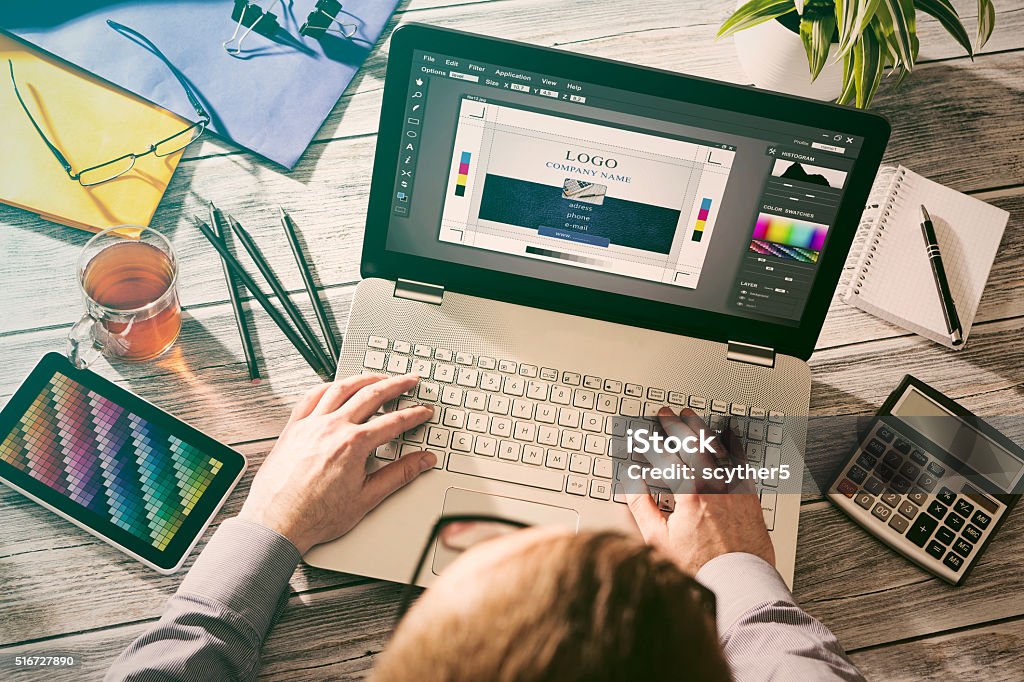 Graphic designer at work. Color samples. Graphic designer at work. Color swatch samples. Graphic Designer Stock Photo
