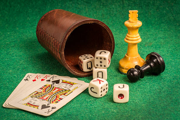 istock Dice Cup with Deck Cards and Chess Pieces 516727985