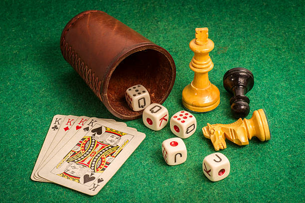 istock Dice Cup with Deck Cards and Chess Pieces 516727987