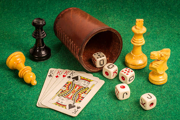 istock Dice Cup with Deck Cards and Chess Pieces 516728011