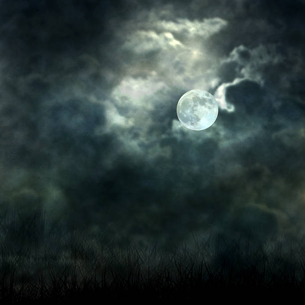 istock Mystical moonlight flowing from the dark sky to the ground 516728415