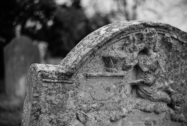istock Detailed sculpture on an old gravestone 516729068
