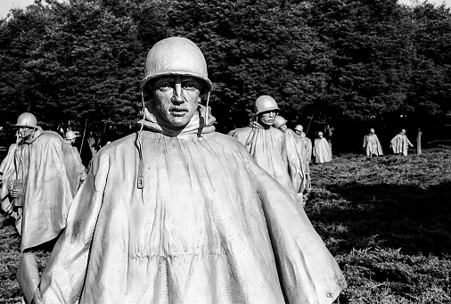 Washingto DC, USA - July 17, 2014: A bronze figure of platoon leader leads his squad through the Korean War Memorial in Washington, DC. (Scanned from black and white film.)