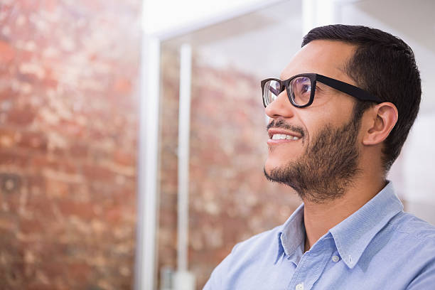 istock Thoughtful young businessman looking away 516729365